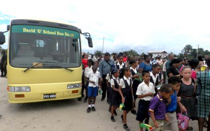 President Granger presents bus to “Mines” children.