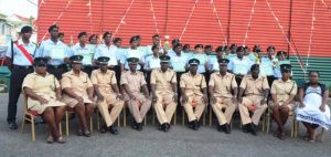 A batch of prison officers following a graduation ceremony.