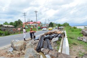 Contractors working on the Friendship sea and river defence project.