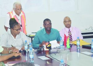 Minister of Public Infrastructure, David Patterson (centre); Minister within the Ministry, Annette Furguson (left); PPP/C’s Member of Parliament, Bishop Juan Edghill and the Ministry of Public Infrastructure’s Technical Advisor, Walter Willis during the media briefing. 