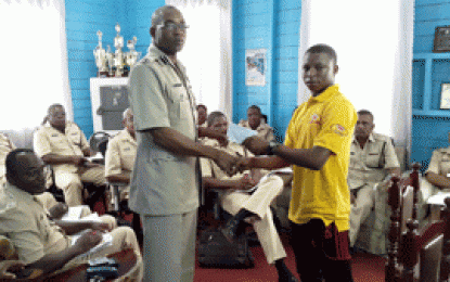 B Division Police Commander, Traffic Officer assists young cyclist, coach for overseas trip