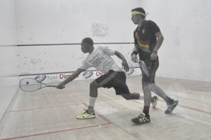 Defending Champion Nyron Joseph plays a backhand shot in victory over Ben Mekdeci at the GT Club on Friday night. (Sean Devers photo)