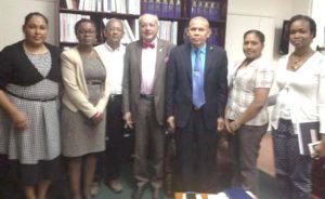 From left, Dr. Kavita Singh, Coordinator of Chronic Disease; Dr. Karen Boyle, Deputy Chief Medical Officer; Dr. Carl Niamatali; Professor Chittaranjan Narahari Purandare; Dr. George Norton, Minister of Public Health; Sarah Daniels, Senior Medex and Dr. Ertenisa Hamilton, Director (ag) Maternal Child Health Programme.