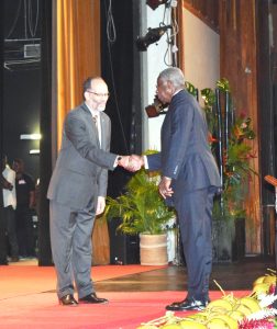 CARICOM Secretary-General, Ambassador Irwin LaRocque (left), greets Barbadian Prime Minister Freundel Stuart during the opening ceremony of Heads of Government conference 