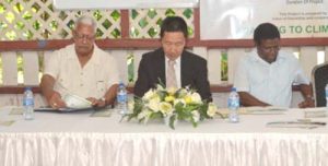 At the head table; Minister of Agriculture Noel Holder, Japanese Ambassador to Guyana H. E. Mitsuhiko Okada and Chief Executive Officer of the National Drainage and Irrigation Authority, Frederick Flatts