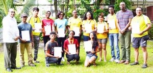 Olympic Day Jog participants showcase their certificates.