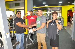 Manager of Space Gym Lucas Matos (2nd right) hands over letter to GABBFF Organising Secretary Videsh Sookram in the presence of Status hotel Manager Ms Kathy Johnson (right) and Trainer Jermaine Snagg.