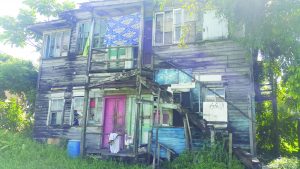 The children were removed from a section in the lower flat of this property. The upstairs is divided into two apartments while the downstairs is also divided into two apartments. The children were living in one of the apartments with their mother and father.