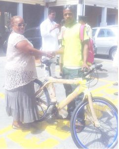 A bike being presented to a youth