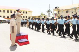 The recruits parading in front of the Commissioner of Police.