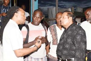 Prime Minister Moses Nagamootoo and Regional Members of Parliament, Jermaine Figueira (left) and Audwin Rutherford, in discussion during the walkabout.