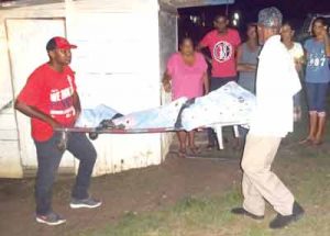 Undertakers removing the woman’s remains