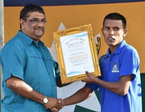 Top UG Student Videsh Ramnauth receives his Award from Regional Chairman David Armogan.