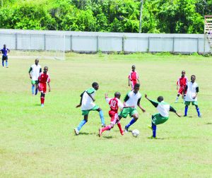 Victoria Kings (green and white) and  BV Triumph United engaged in battle  yesterday at the Melanie ground, ECD.