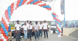 Yokohama General Manager Deepak Balradj cuts the ribbon at the opening of the Guyana outlet.