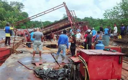 Authorities battle time to surface, remove sunken dredge from River channel