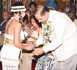 Prime Minister Moses Nagamootoo being garlanded