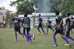 Celebration Time! KK Warriors players celebrating their first goal against Herstelling Raiders at the Grove Playfield.