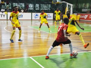 Guyana on the defensive against Suriname.