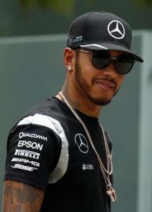 Mercedes’ Lewis Hamilton of Britain arrives ahead of the third practice. (REUTERS/Edgar Su)