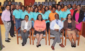 (Seated L-R) Dr. Karen Gordon-Boyle, Minister Dr. Karen Cummings, PAHO/WHO Country Rep. Dr. William Adu-Krow and Director, Regional Health Services, Ministry of Public Health, Dr. Kay Shako in the company of participants of the recent meeting.