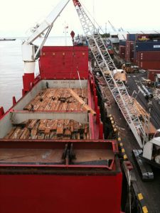 Lumber being loaded in Guyana.