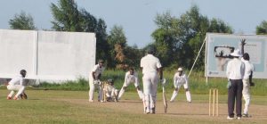 Eon Hooper bowls to Shiv Chanderpaul who ended the day on a composed 49. (Sean Devers photo)