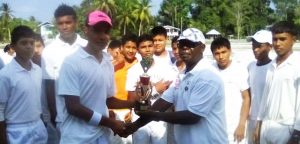 GCB’s representative Andrew Allen presents to winning trophy to St Cuthbert’s Secondary Captain Eidin Kactow.  