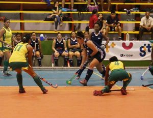 Pizza Hut GCC’s Gabriella Xavier attempts to weave past a host of Woodpecker Hikers players during their clash on Friday at the National Gymnasium.