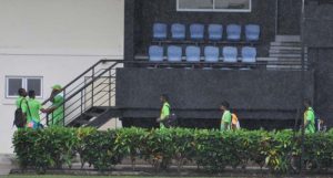  The Jaguar players and Coach arrive at the Daren Sammy CG yesterday in rain. (Sean Devers photo)