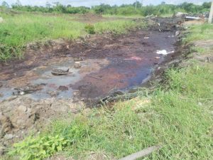 The location where persons would dump oil into the waterway.