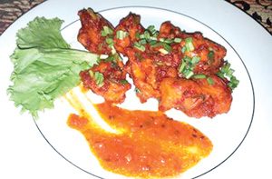 Schezwan Chicken (Asian Fusion) Boneless chicken deep fried and stir fried in Schezwan sauce Maharaja Palace (facebook photo) 