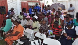 Residents of Victoria listen intently to Minister Cummings.