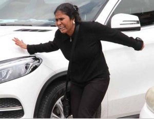 Distressed: A relative of Keshwar Ragoobeer weeps outside the Forensic Science Centre in St James yesterday. Ragoobeer died on Friday following an explosion at a company in Central Trinidad where he was employed. (Photo: Alexander Bruzual)