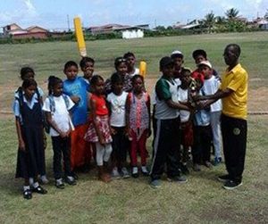  Blairmont Primary School’s Veer Farhad accepts the trophy from David Black of the WBCA.