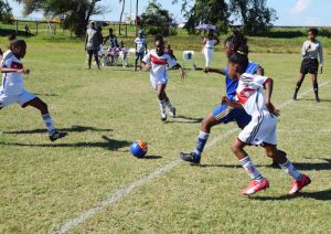 Part of the action between St. Angela’s (white uniforms) and Enterprise yesterday.