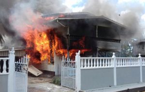 Flames engulfing the home