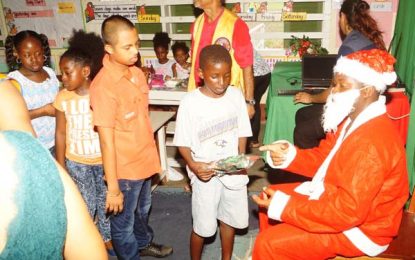 Central Demerara Lions fete 300 children