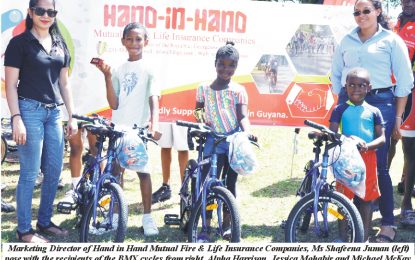 Hand in Hand presents BMX  cycles to three young riders