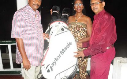 Guyana Foundation UK presents golf equipment to Yassin of Ogle SC