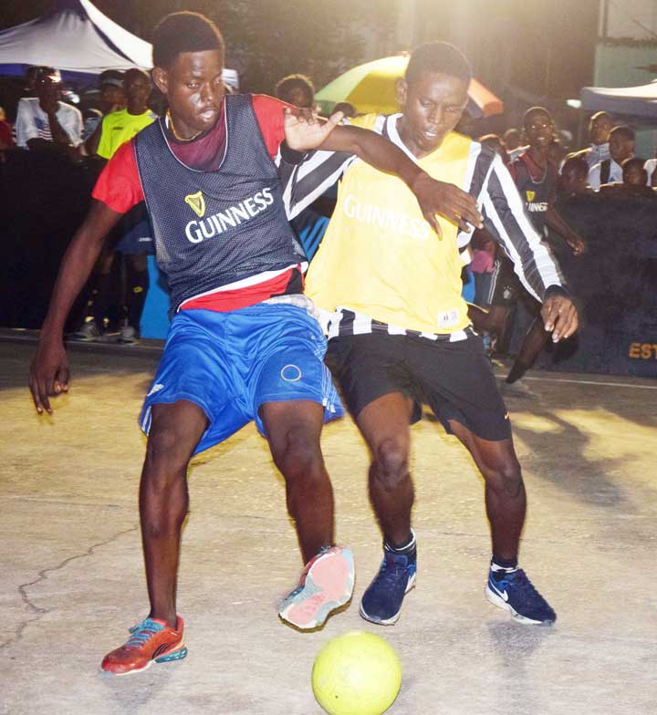 https://www.kaieteurnewsonline.com/images/2017/12/A-strong-challenge-for-the-ball-between-opposing-players-in-the-Sophia-vs-Bent-Street-clash.jpg