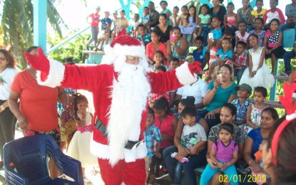 Essequibian family spreads spirit of Christmas with over 1000 children