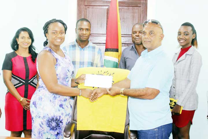 https://www.kaieteurnewsonline.com/images/2018/01/Cash-in-Hand-The-Million-Dollar-Cheque-being-handed-over-to-the-BDBA.jpg