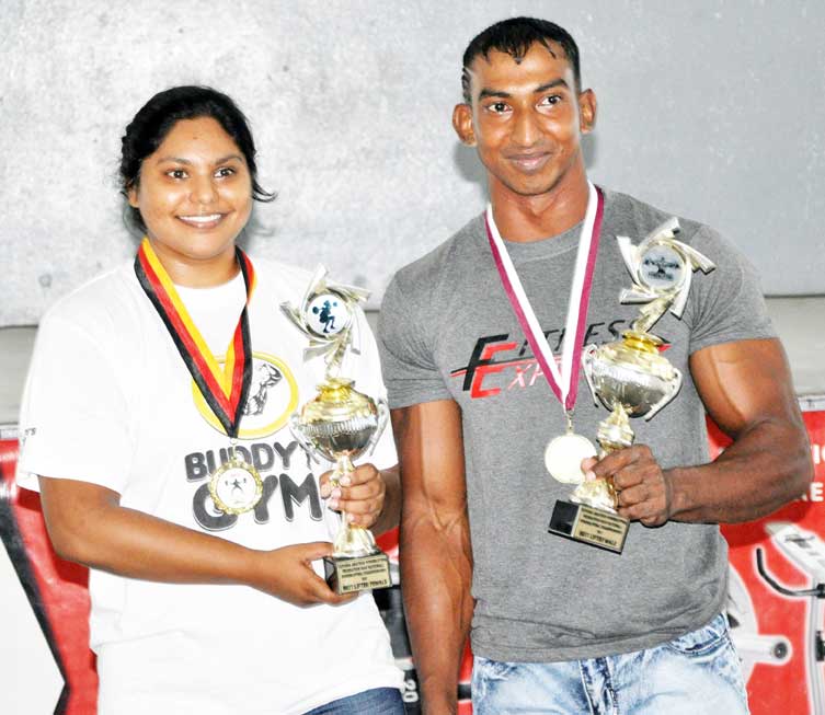 https://www.kaieteurnewsonline.com/images/2018/01/RAW-Nationals-Overall-Winners-Lisa-Oudit-left-and-Vijai-Rahim-display-their-trophies..jpg