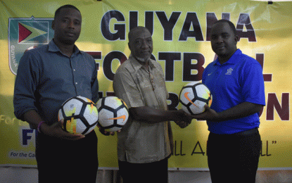 GFA/Stag Beer Revival Cup… GFF present footballs to enable execution of tournament