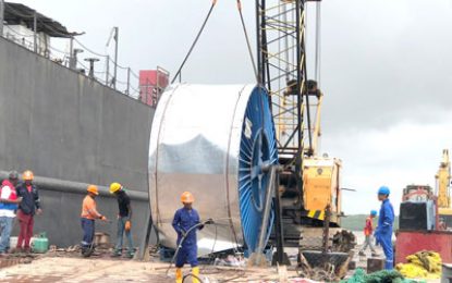 Temporary submarine cable being laid across the Demerara River to reduce power outages