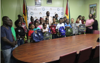 DOS Jones presents backpacks to Windball Cricket winners