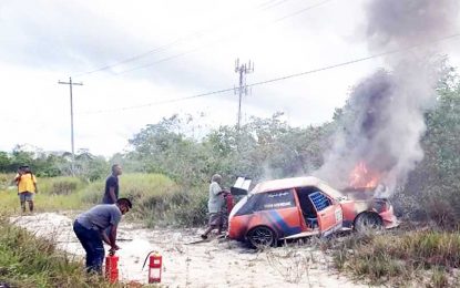 Race car driver escapes burning vehicle