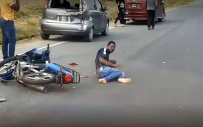 Motorcyclist collide with parked car