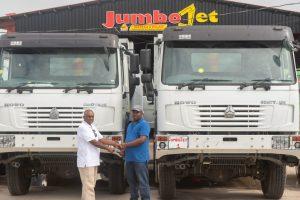 Contractor Kris Jagdeo received keys to three of Sinotruk branded heavy-duty dump trucks from Jumbo Jet Auto Sales on Wednesday